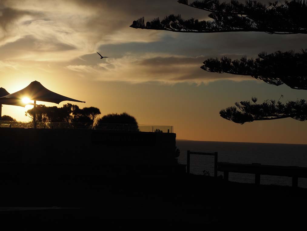Sunset over the Penneshaw Hotel beer garden which looks out over the ocean. 